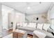 Bright living room features hardwood floors, modern decor, and a comfortable gray sofa with white pillows at 27 Brockman Dr # 27-C, Charleston, SC 29412