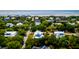 Aerial view of coastal community showcasing lush greenery and ocean views at 2870 Ion Ave, Sullivans Island, SC 29482