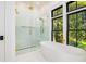 Luxurious bathroom featuring a standalone tub, a spacious glass shower, and modern fixtures at 2870 Ion Ave, Sullivans Island, SC 29482