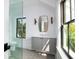 Bright bathroom featuring vanity, quartz countertop, and a glass shower at 2870 Ion Ave, Sullivans Island, SC 29482