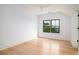 Bright bedroom featuring hardwood floors, a modern ceiling fan, and a window with natural light at 2870 Ion Ave, Sullivans Island, SC 29482