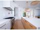 Beautiful kitchen featuring custom white cabinets, stainless steel appliances, and a kitchen island with a sink at 2870 Ion Ave, Sullivans Island, SC 29482