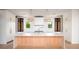 Elegant kitchen featuring a center island, custom cabinets, pendant lighting, and modern appliances at 2870 Ion Ave, Sullivans Island, SC 29482