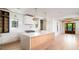 Stylish kitchen featuring a large island, white cabinets, a gas range, and modern pendant lights at 2870 Ion Ave, Sullivans Island, SC 29482