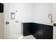 Laundry room featuring black cabinets, white countertop, faucet, and washer hookups at 2870 Ion Ave, Sullivans Island, SC 29482
