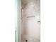 Modern shower featuring stylish tile, a shower head, and a built-in shelf at 2870 Ion Ave, Sullivans Island, SC 29482