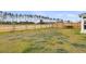 A spacious backyard features lush green grass, a hammock, and a sturdy wooden fence at 292 Shadybrook Dr, Summerville, SC 29486