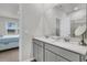 Bathroom featuring a double vanity, framed mirror, neutral color palette, and view into main bedroom at 292 Shadybrook Dr, Summerville, SC 29486