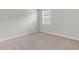 Empty bedroom featuring neutral colored carpet, baseboards and walls at 292 Shadybrook Dr, Summerville, SC 29486