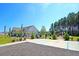 Community clubhouse featuring manicured landscaping, a playground, and designated parking spaces at 292 Shadybrook Dr, Summerville, SC 29486