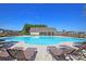 Large community pool with clear blue water and lounge chairs, ideal for relaxation and social gatherings at 292 Shadybrook Dr, Summerville, SC 29486