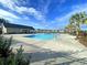 Beautiful community pool surrounded by palm trees, providing a serene and inviting atmosphere for residents at 292 Shadybrook Dr, Summerville, SC 29486