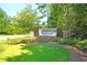 Sanctuary Cove entrance sign surrounded by lush greenery and mature trees creating a welcoming atmosphere at 292 Shadybrook Dr, Summerville, SC 29486