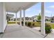 Inviting front porch with white columns and view of the street at 292 Shadybrook Dr, Summerville, SC 29486