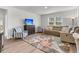 Cozy living room with a floral rug, comfortable seating, and a large window for natural light at 292 Shadybrook Dr, Summerville, SC 29486