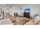 Inviting living room featuring a floral rug, comfortable sofa, and a TV at 292 Shadybrook Dr, Summerville, SC 29486
