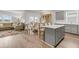 Open-concept living space with a kitchen island, dining table, and comfortable seating area at 292 Shadybrook Dr, Summerville, SC 29486