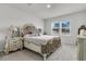 Main bedroom with tufted headboard, detailed bedside tables, and a neutral color palette at 292 Shadybrook Dr, Summerville, SC 29486
