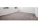 Bright bedroom with neutral walls, two windows, plush carpeting, and white trim at 302 Chapman Cir, Goose Creek, SC 29445