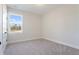 Bedroom features neutral carpet, light gray walls, and a sunny window view at 302 Chapman Cir, Goose Creek, SC 29445
