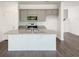 Kitchen boasts gray cabinets, stainless steel appliances, granite countertops and a center island at 302 Chapman Cir, Goose Creek, SC 29445