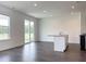 Open-concept living room featuring a dark wood floor, sliding glass doors, and a kitchen island at 302 Chapman Cir, Goose Creek, SC 29445