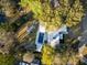 Aerial view of a modern home with a pool, white hardscape, and lush landscaping at 317 Seewee Cir, Mount Pleasant, SC 29464