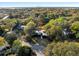 Aerial view of a home with a river in the background, mature landscaping and the surrounding neighborhood at 317 Seewee Cir, Mount Pleasant, SC 29464