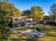 Expansive backyard with a pool, outdoor seating, fire pit and lush lawn for outdoor enjoyment at 317 Seewee Cir, Mount Pleasant, SC 29464