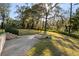 Picturesque backyard with a fire pit, lush greenery, and a tranquil ambiance, ideal for outdoor enjoyment at 317 Seewee Cir, Mount Pleasant, SC 29464