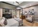 Elegant bedroom featuring canopy bed, sitting area, and access to the backyard at 317 Seewee Cir, Mount Pleasant, SC 29464
