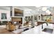 Open living area with a fireplace, bright light, and a seamless transition to the kitchen at 317 Seewee Cir, Mount Pleasant, SC 29464