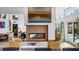 Open living area with modern fireplace, and an abundance of natural light at 317 Seewee Cir, Mount Pleasant, SC 29464