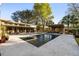 Stunning backyard with a modern pool, spa, and outdoor living area, perfect for relaxation and entertaining at 317 Seewee Cir, Mount Pleasant, SC 29464