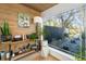 Cozy sunroom with natural light, modern decor, and a tranquil view of the exterior garden at 317 Seewee Cir, Mount Pleasant, SC 29464
