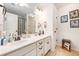 Bathroom with double sinks, a large mirror, and neutral decor at 317 Whispering Breeze Ln, Summerville, SC 29486