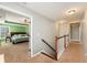 Hallway view of a bedroom showcasing natural light, neutral tones, and comfortable carpeting at 317 Whispering Breeze Ln, Summerville, SC 29486