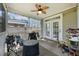 Outdoor porch with an outdoor grill, multiple chairs, and an overhead fan at 317 Whispering Breeze Ln, Summerville, SC 29486
