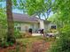 Backyard with a patio area, seating, and mature trees for shade at 325 Dupont Way, Summerville, SC 29485