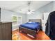 Bedroom with hardwood floors, ceiling fan, and a comfortable bed at 325 Dupont Way, Summerville, SC 29485