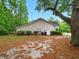 Home with a large tree, lush lawn, and an outdoor seating area at 325 Dupont Way, Summerville, SC 29485