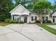 Inviting single-story home featuring a well-kept lawn and a concrete driveway at 325 Dupont Way, Summerville, SC 29485