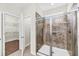 Bathroom featuring tiled shower with glass doors and open doorway to a walk-in closet at 3321 Tabard Rd, Johns Island, SC 29455