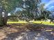 Scenic picnic area under a large, shady tree with a wooden picnic table near the water at 3321 Tabard Rd, Johns Island, SC 29455