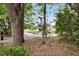 Scenic view of a pond with a sandy beach and tree shaded path at 3321 Tabard Rd, Johns Island, SC 29455