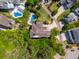 Aerial view showcasing the home's large lot, sparkling pools, and lush landscaping in a beautiful neighborhood at 337 Evian Way, Mount Pleasant, SC 29464