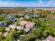 Stunning aerial view of a luxury home surrounded by lush greenery and a scenic marsh at 337 Evian Way, Mount Pleasant, SC 29464