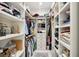Walk-in closet with ample storage space for clothes, shoes, and accessories with built-in shelving at 337 Evian Way, Mount Pleasant, SC 29464