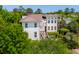 Aesthetic shot of two-story home surrounded by lush trees and greenery at 337 Evian Way, Mount Pleasant, SC 29464