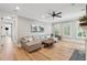 Spacious living room with light wood floors, comfortable seating, and a unique wooden coffee table at 337 Evian Way, Mount Pleasant, SC 29464